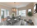 Formal dining room with hardwood floors, staged furniture, and neutral walls at 435 Tellico Sw Cir, Atlanta, GA 30331