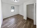 Bright bedroom with wood flooring and spacious closet at 5351 Zachary Dr, Stone Mountain, GA 30083