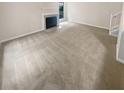 Living room with fireplace and neutral carpeting at 1097 Rock Creek Ln, Norcross, GA 30093