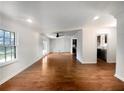 Bright living room with hardwood floors and access to the kitchen and dining area at 4128 Snapfinger Way, Decatur, GA 30035