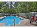 Inviting rectangular pool with lounge chairs and lattice fence at 20 Mahan Ne Ln, Rydal, GA 30171