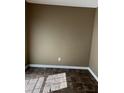 Small room with brown walls and dark tile floors at 9184 S Sterling Lakes S Dr, Covington, GA 30014