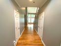 Bright and spacious entryway with hardwood floors and access to other rooms at 617 Vinings Estates Se Dr, Mableton, GA 30126