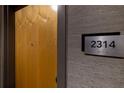 Apartment entry with wood door and numbered plaque at 400 W Peachtree Nw St # 2314, Atlanta, GA 30308