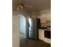 Kitchen features stainless steel refrigerator and white cabinets at 4356 Housworth Dr, Stonecrest, GA 30038