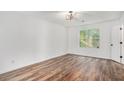 Bright bedroom with wood-look flooring and neutral walls at 186 Antebellum Ct, Riverdale, GA 30274