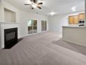 Living room with fireplace and sliding glass doors to patio at 709 Celeste Sw Ln, Atlanta, GA 30331