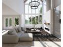 Spacious living room with high ceilings, a large window, and a modern fireplace at 474 Eastland Dr, Decatur, GA 30030