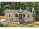 Newly renovated brick house with a welcoming front porch at 1847 Ridgeland Dr, Decatur, GA 30032