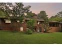 Back of brick house, showcasing a large yard at 1272 Breezy Ne Ln, Atlanta, GA 30329