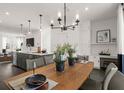 Bright dining area with wood table and modern chandelier at 201 New St # 2106 -109, Decatur, GA 30030