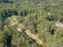 Aerial view of a wooded lot with property line highlighted at 1645 Highpoint Rd, Snellville, GA 30078