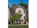 Beige two-story home with gray roof and landscaping at 2290 Park Walke Dr, Alpharetta, GA 30009