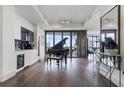 Living room with grand piano, wet bar and stunning city views at 3107 Peachtree Ne Rd # 1101, Atlanta, GA 30305