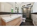 Modern bathroom with double vanity, large shower, and marble tile at 1261 Lavista Rd # F-3, Atlanta, GA 30324