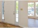 Front entry with a light-colored door and wood-look flooring at 1666 Paddlewheel Dr, Marietta, GA 30062