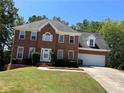 Two story brick home with attached garage at 6209 Southland Forest Dr, Stone Mountain, GA 30087