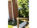 Side yard with steps leading to the deck at 6209 Southland Forest Dr, Stone Mountain, GA 30087
