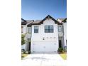 Modern two-story townhome with white exterior at 51 S Auburn Landing Pl # 51, Auburn, GA 30011