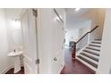 Bright foyer with powder room and hardwood floors at 51 S Auburn Landing Pl # 51, Auburn, GA 30011