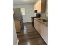 Kitchen with wood cabinets and dark floors at 2164 Mark Trl, Decatur, GA 30032