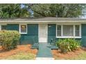 Green brick ranch house with front porch at 1215 Richland Sw Rd, Atlanta, GA 30310
