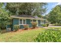 Charming ranch home with green exterior at 1215 Richland Sw Rd, Atlanta, GA 30310