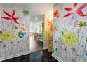 Bright entryway with a colorful floral wall mural at 3300 Windy Ridge Se Pkwy # 1110, Atlanta, GA 30339