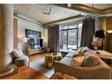Bright and airy living room with hardwood floors and city views at 115 W Peachtree Nw Pl # 301, Atlanta, GA 30313
