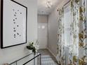 Light and airy entryway with patterned curtains and console table at 5174 Longview Run, Decatur, GA 30035