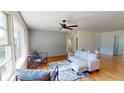 Modern living room with hardwood floors, gray accent wall, and comfortable seating at 2790 Miriam Ln, Decatur, GA 30032