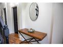 Bright entryway with wood floors and console table at 9931 Mancunian Way, Douglasville, GA 30135