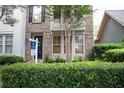 Townhouse exterior with landscaping and for sale sign at 9931 Mancunian Way, Douglasville, GA 30135