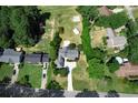 Aerial view showing home, large backyard, and surrounding properties at 3573 Clubhouse Ln, Conyers, GA 30094