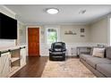 Living room with gray couch, wood flooring, and entryway at 7206 Highway 101 N, Rockmart, GA 30153