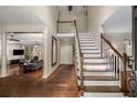 Two-story foyer with hardwood floors and staircase at 1195 Vineyard Se Dr, Conyers, GA 30013