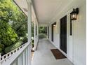 Inviting front porch with wooden railings at 1195 Vineyard Se Dr, Conyers, GA 30013