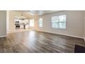 Open living room and kitchen with luxury vinyl plank flooring at 6635 Shapiro Ct, Stone Mountain, GA 30087