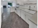 Kitchen with white cabinets, sink and appliances at 3805 Stonewall Se Ter # 3805, Atlanta, GA 30339