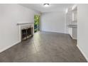 Bright living room with fireplace and tile floors at 3805 Stonewall Se Ter # 3805, Atlanta, GA 30339