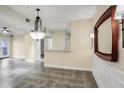 Spacious dining area with tile floors and elegant chandelier at 955 Juniper Ne St # 4125, Atlanta, GA 30309