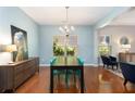 Dining room with hardwood floors and a chandelier at 239 Brookhaven Ct, Acworth, GA 30102