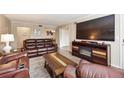 Relaxing living room with leather furniture and built-in fireplace at 6851 Roswell Rd # E1, Atlanta, GA 30328