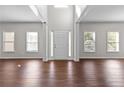 Bright foyer with hardwood floors and neutral walls at 906 Fox Croft Pl, Canton, GA 30114