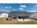 Back of house with screened porch and large backyard at 3378 Chosen Blvd, Snellville, GA 30078