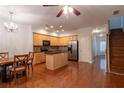 Open concept kitchen with island and hardwood floors at 2986 Ashlyn Pointe Dr, Atlanta, GA 30340