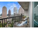 Spacious balcony with city view and comfortable outdoor seating at 1080 Peachtree Ne St # 2512, Atlanta, GA 30309