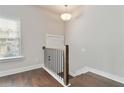 Open staircase with a modern black railing at 1405 Attwater Dr, Atlanta, GA 30316