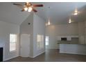Open living room with high ceilings and hardwood floors at 3475 Washington Rd, Atlanta, GA 30344