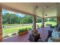 Covered porch overlooking a large yard at 3112 Highway 155 N, Mcdonough, GA 30252